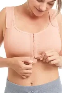 Sina Seamless Post-Surgical Bra Rose Nude. Photo of a woman modeling the bra.
