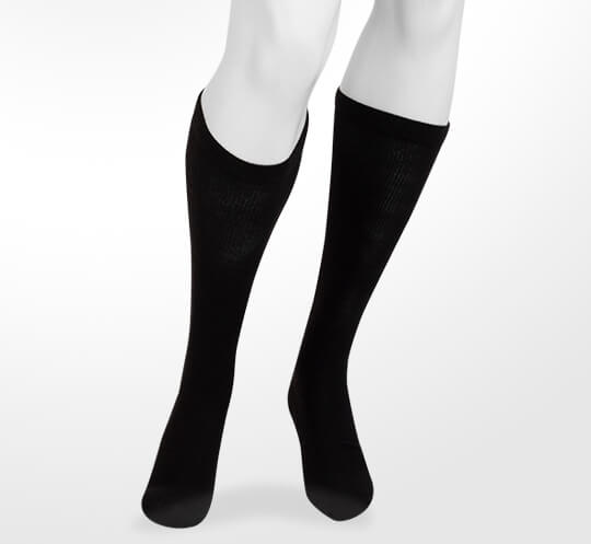 Juzo Power Lite Compression Socks. Image of the compression socks in black.